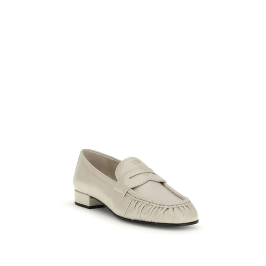 Prada Beige Calf Leather Bos Taurus Slip-On Loafers Curated Luxury Accessories by Orvyn