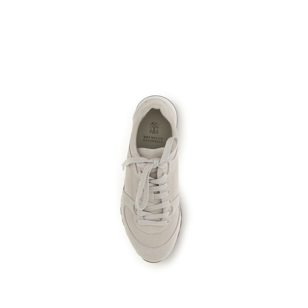 Brunello Cucinelli Beige Calf Leather Bos Taurus Low Top Sneakers Curated Luxury Accessories by Orvyn