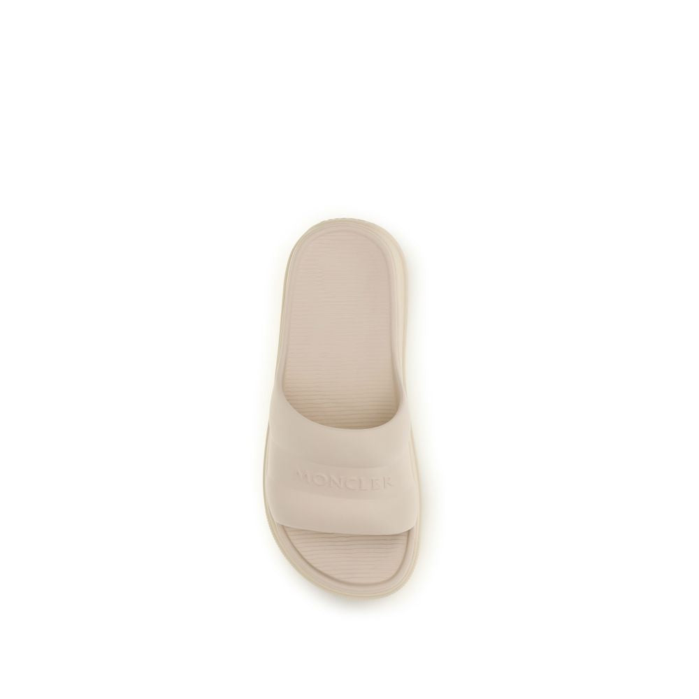 Moncler Beige Rubber Slippers Curated Luxury Accessories by Orvyn