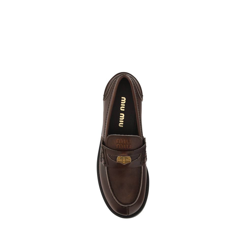 Miu Miu Brown Calf Leather Bos Taurus Slip-On Loafers Curated Luxury Accessories by Orvyn