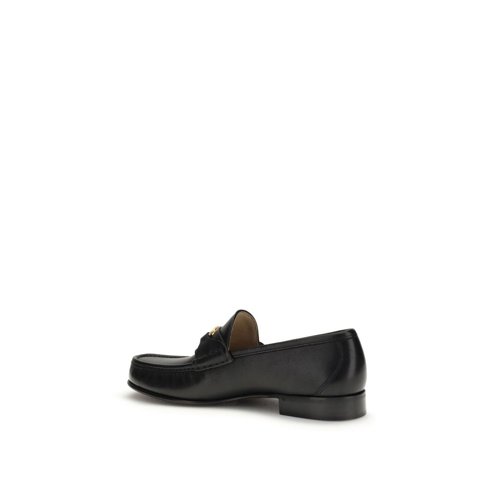 Valentino Garavani Black Calf Leather Bos Taurus Slip-On Loafers Curated Luxury Accessories by Orvyn