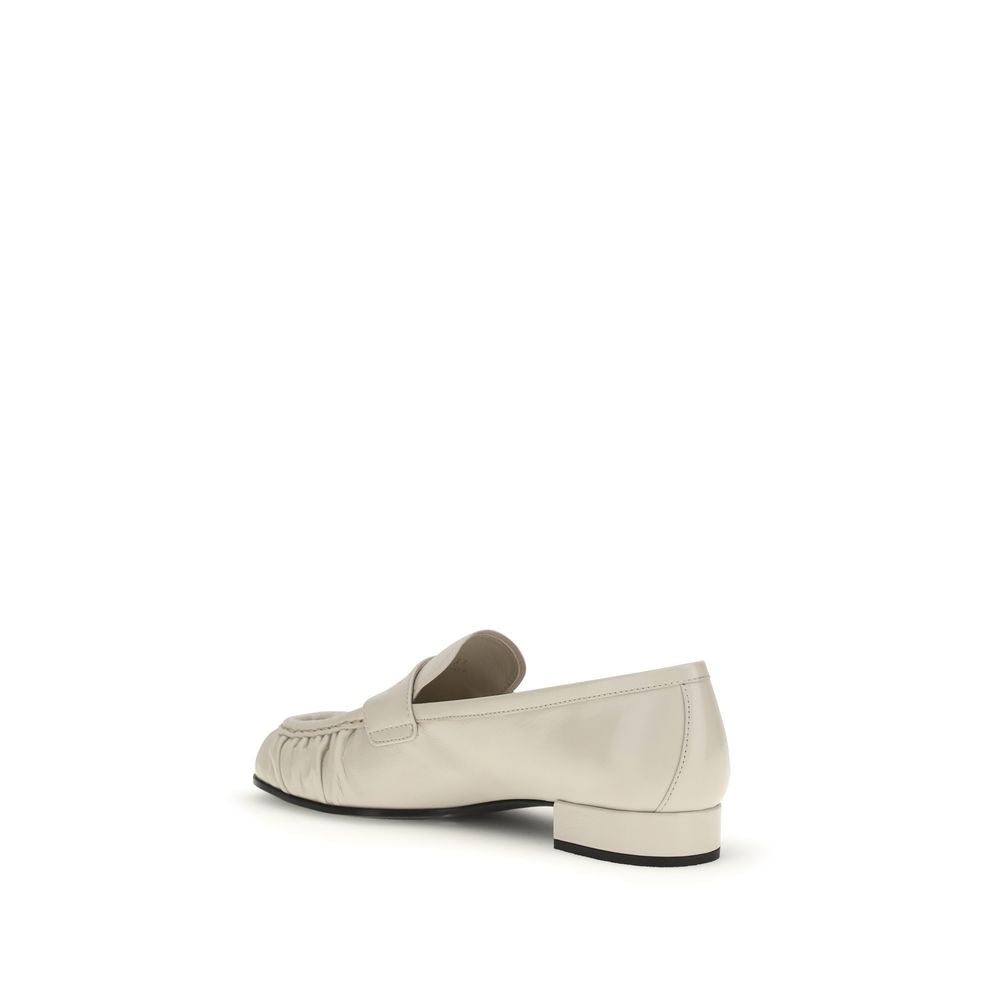 Prada Beige Calf Leather Bos Taurus Slip-On Loafers Curated Luxury Accessories by Orvyn