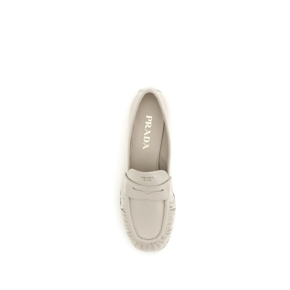 Prada Beige Calf Leather Bos Taurus Slip-On Loafers Curated Luxury Accessories by Orvyn