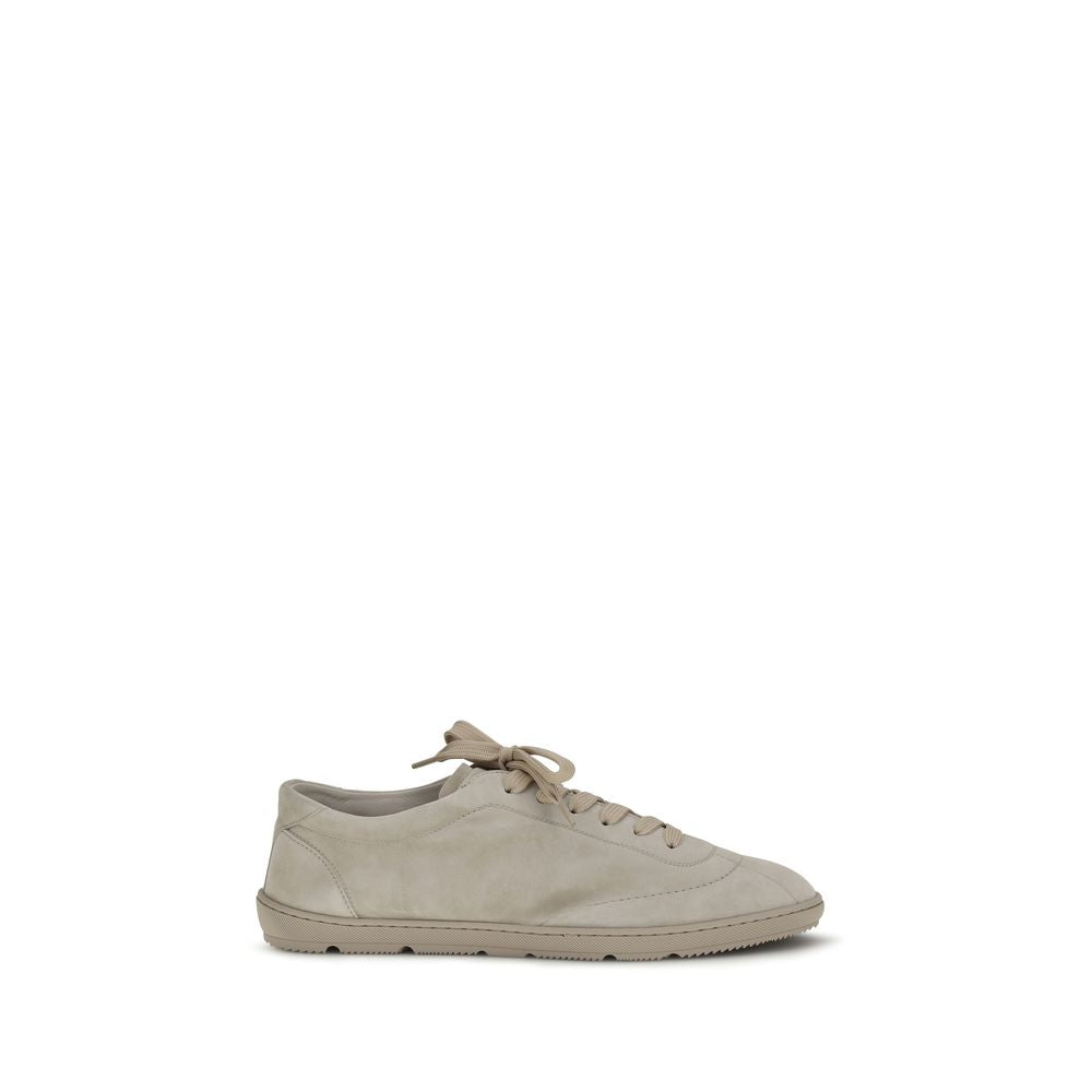 Brunello Cucinelli Beige Calf Leather Bos Taurus Low Top Sneakers Curated Luxury Accessories by Orvyn