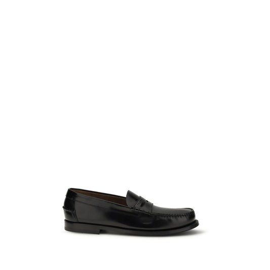 Prada Black Calf Leather Bos Taurus Slip-On Loafers Curated Luxury Accessories by Orvyn