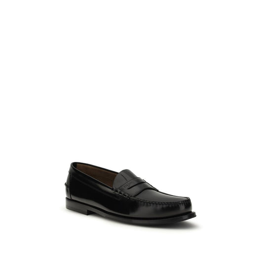 Prada Black Calf Leather Bos Taurus Slip-On Loafers Curated Luxury Accessories by Orvyn