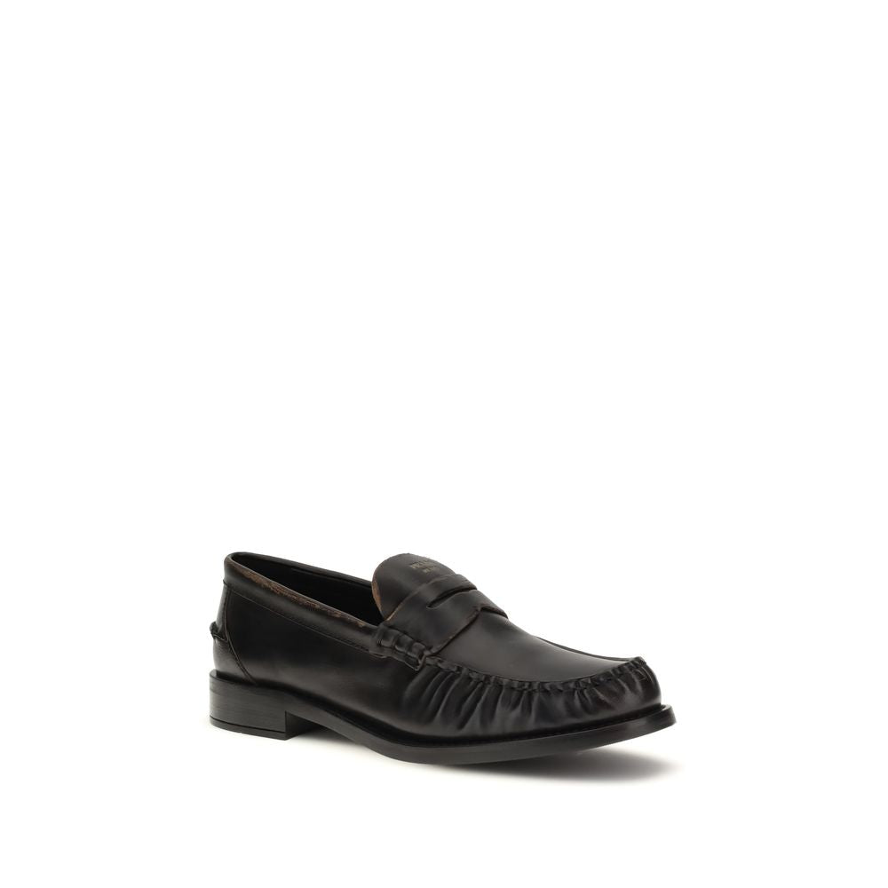 Prada Black Calf Leather Bos Taurus Slip-On Loafers Curated Luxury Accessories by Orvyn