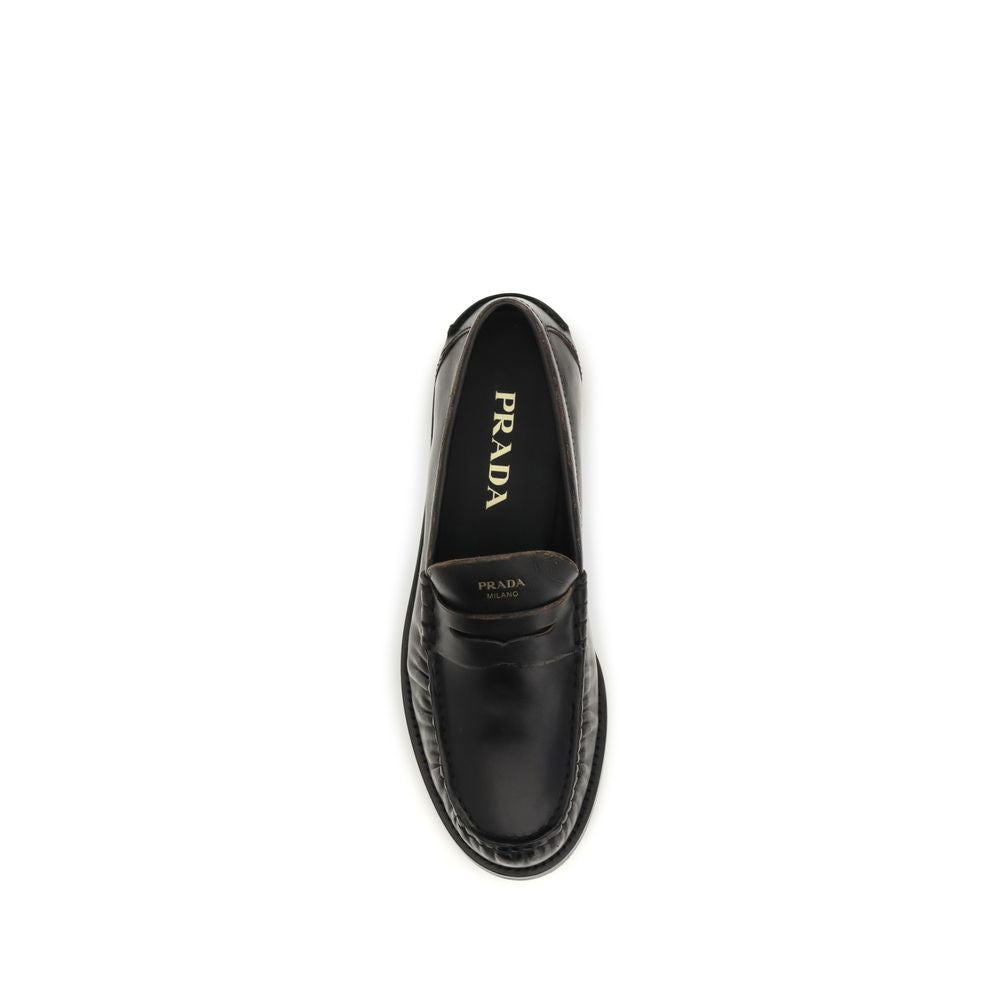 Prada Black Calf Leather Bos Taurus Slip-On Loafers Curated Luxury Accessories by Orvyn
