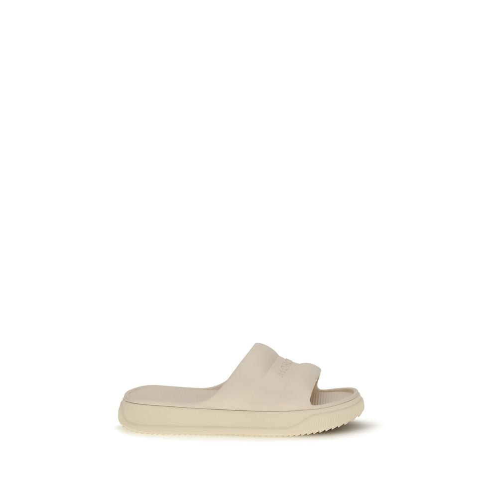 Moncler Beige Rubber Slippers Curated Luxury Accessories by Orvyn