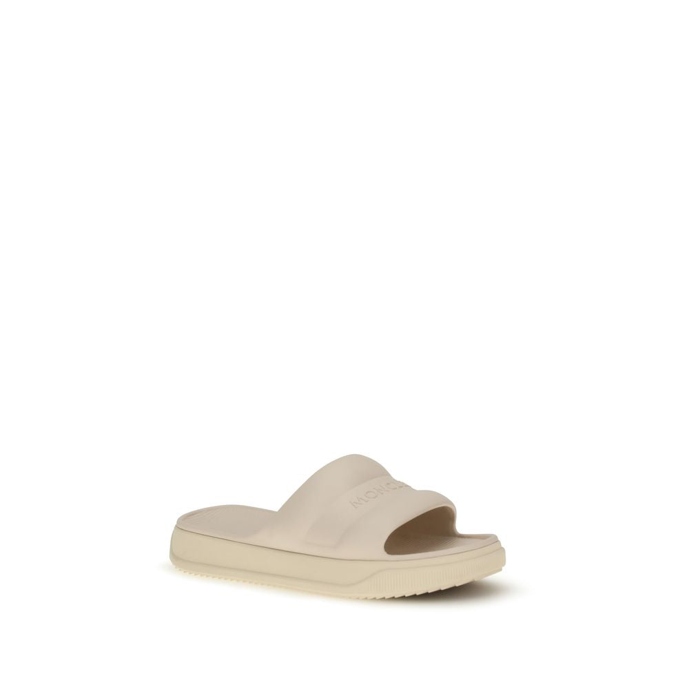 Moncler Beige Rubber Slippers Curated Luxury Accessories by Orvyn