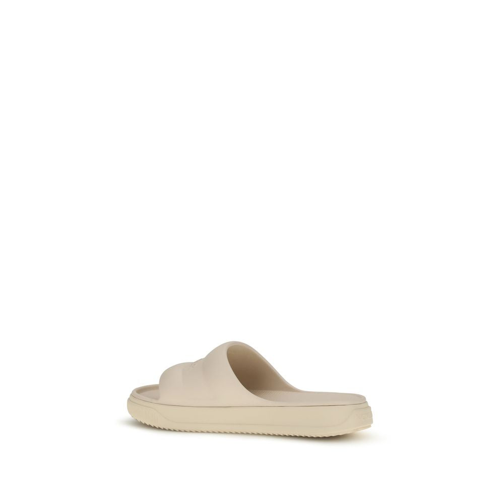 Moncler Beige Rubber Slippers Curated Luxury Accessories by Orvyn