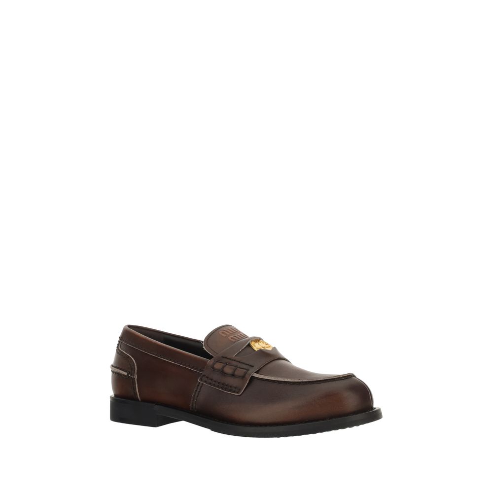 Miu Miu Brown Calf Leather Bos Taurus Slip-On Loafers Curated Luxury Accessories by Orvyn