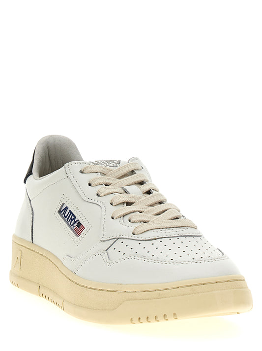 Autry Bicolor Calfskin Low Top Sneakers Curated Luxury Accessories by Orvyn