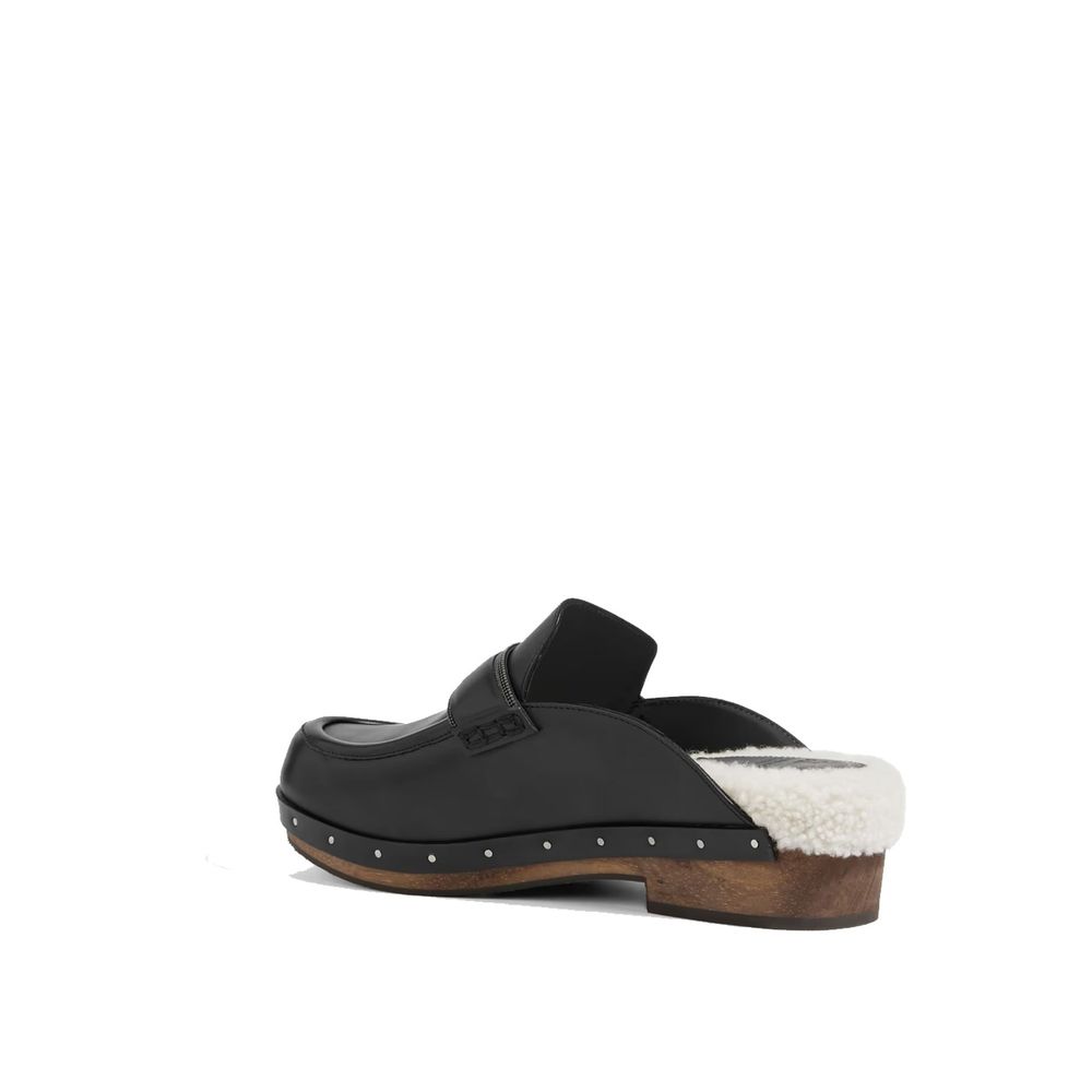 Brunello Cucinelli Black Leather Mules Curated Luxury Accessories by Orvyn