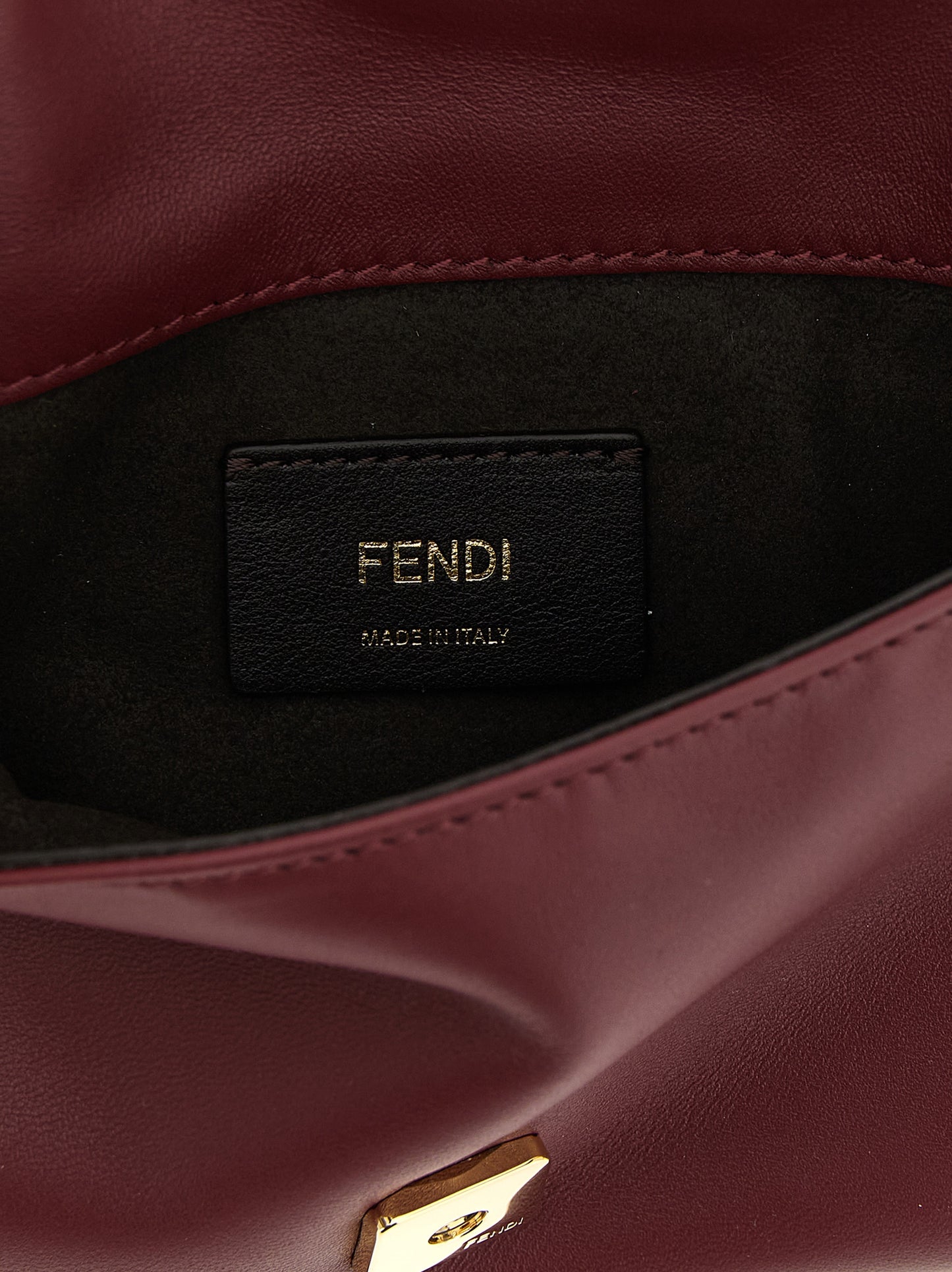 Fendi Bordeaux Lamb Leather Clutch Bag Curated Luxury Accessories by Orvyn