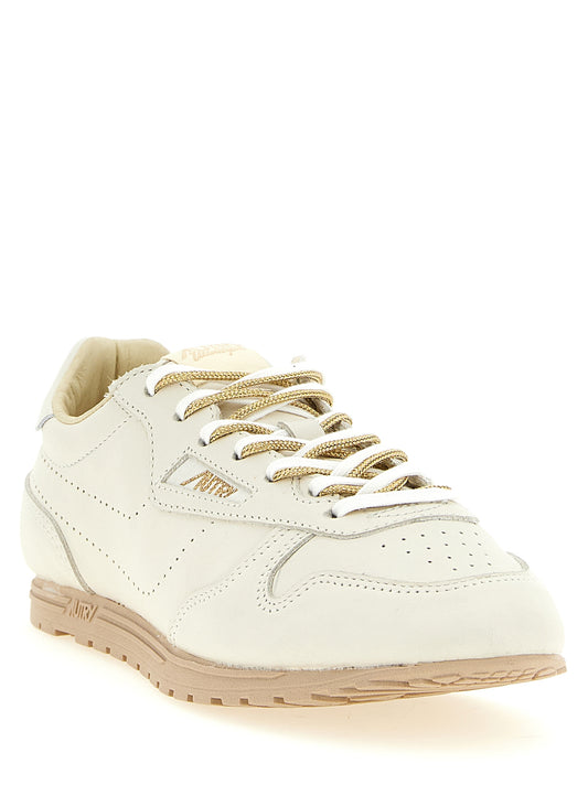 Autry Beige Cowhide Low Top Sneakers Curated Luxury Accessories by Orvyn