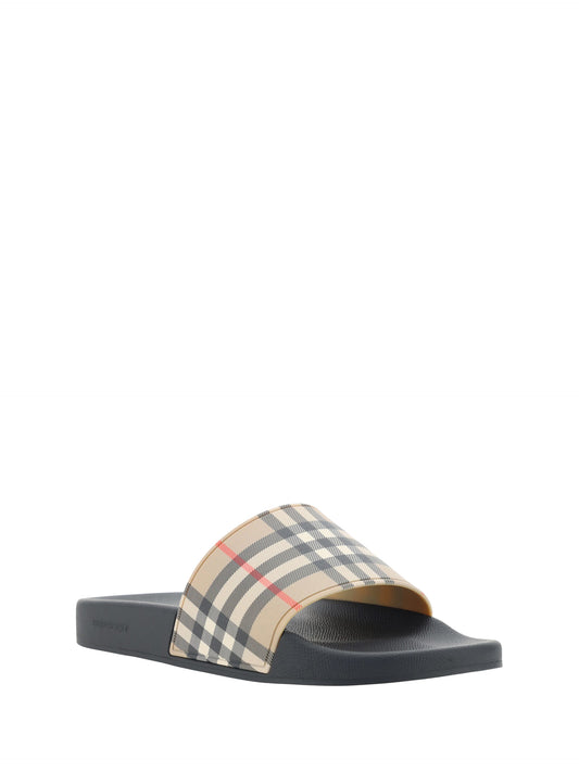 Burberry Brown Rubber Slides Sandals Curated Luxury Accessories by Orvyn