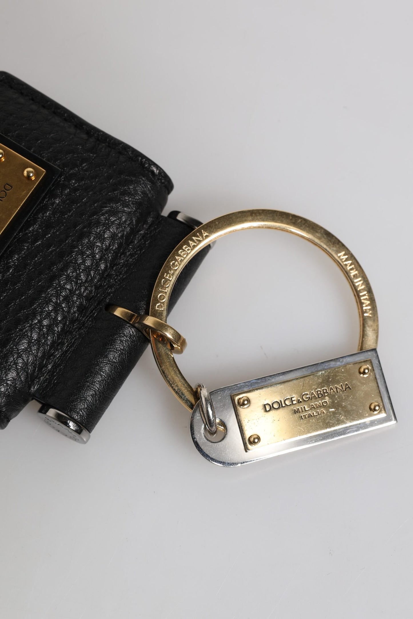 Dolce & Gabbana Black Leather Strap Gold Metal Logo Plaque Airpods Case Curated Luxury Accessories by Orvyn