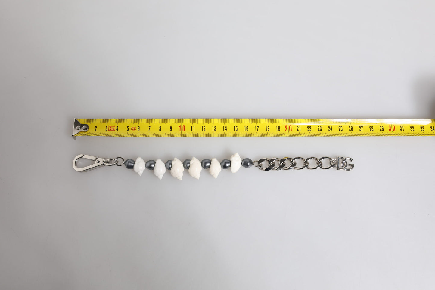 Dolce & Gabbana Silver Tone Brass Beaded Shell DG Logo Pendant Bracelet Curated Luxury Accessories by Orvyn