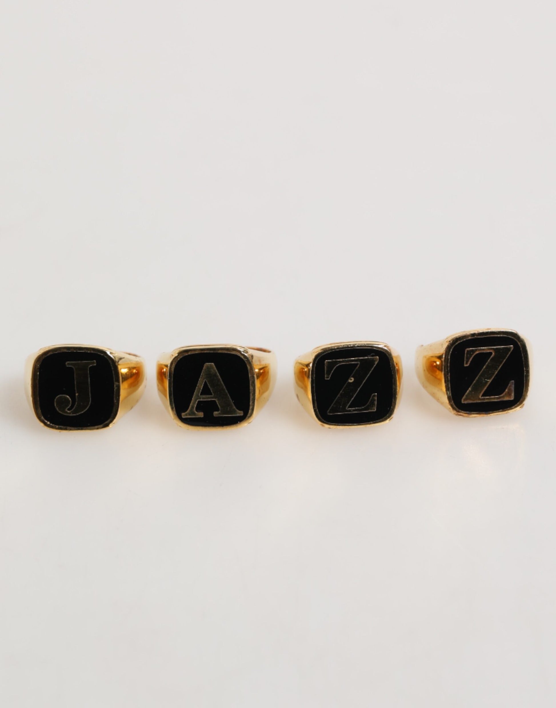 Dolce & Gabbana Gold Tone Brass JAZZ Letter Set 4 Pieces Adjustable Ring Curated Luxury Accessories by Orvyn