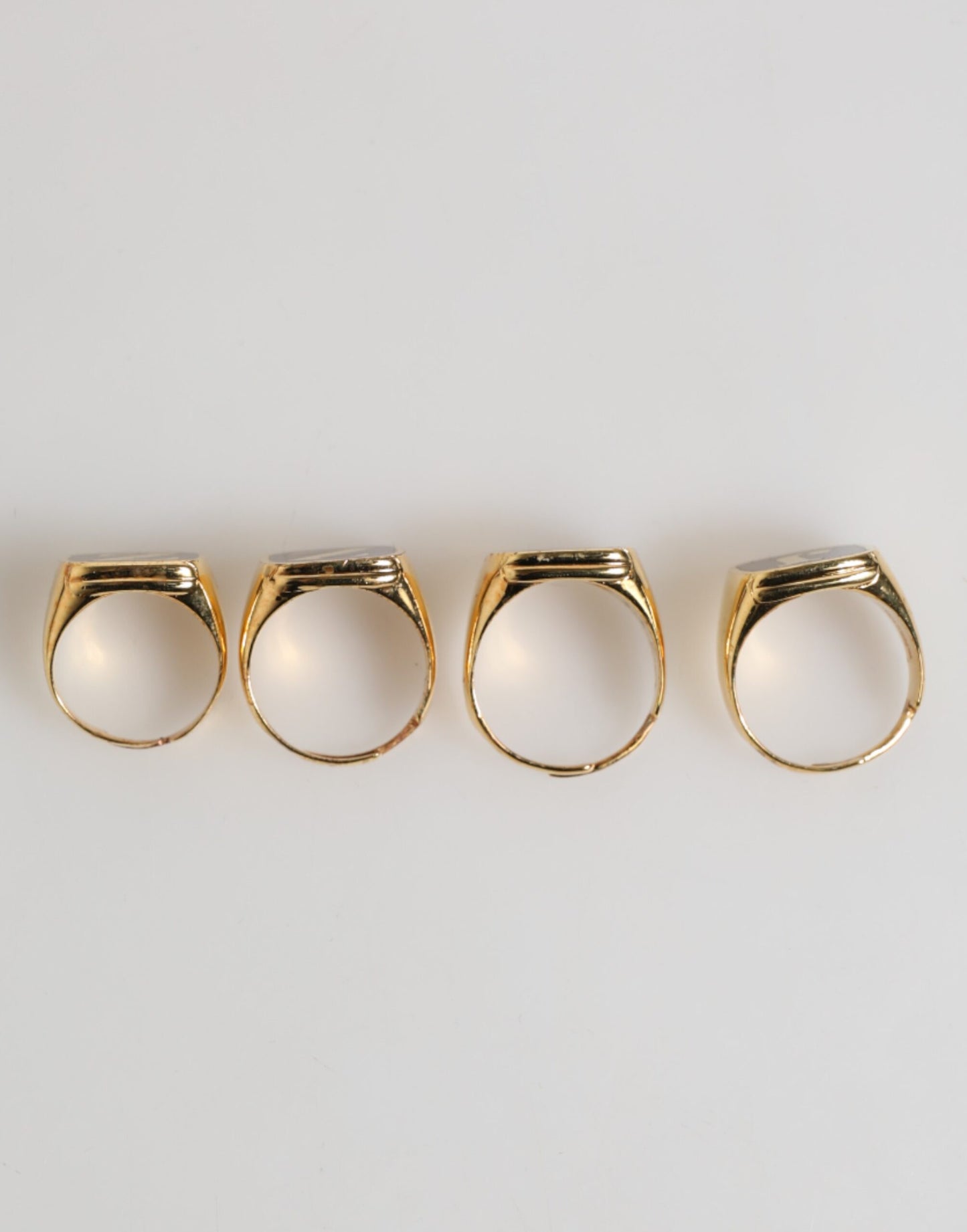 Dolce & Gabbana Gold Tone Brass JAZZ Letter Set 4 Pieces Adjustable Ring Curated Luxury Accessories by Orvyn