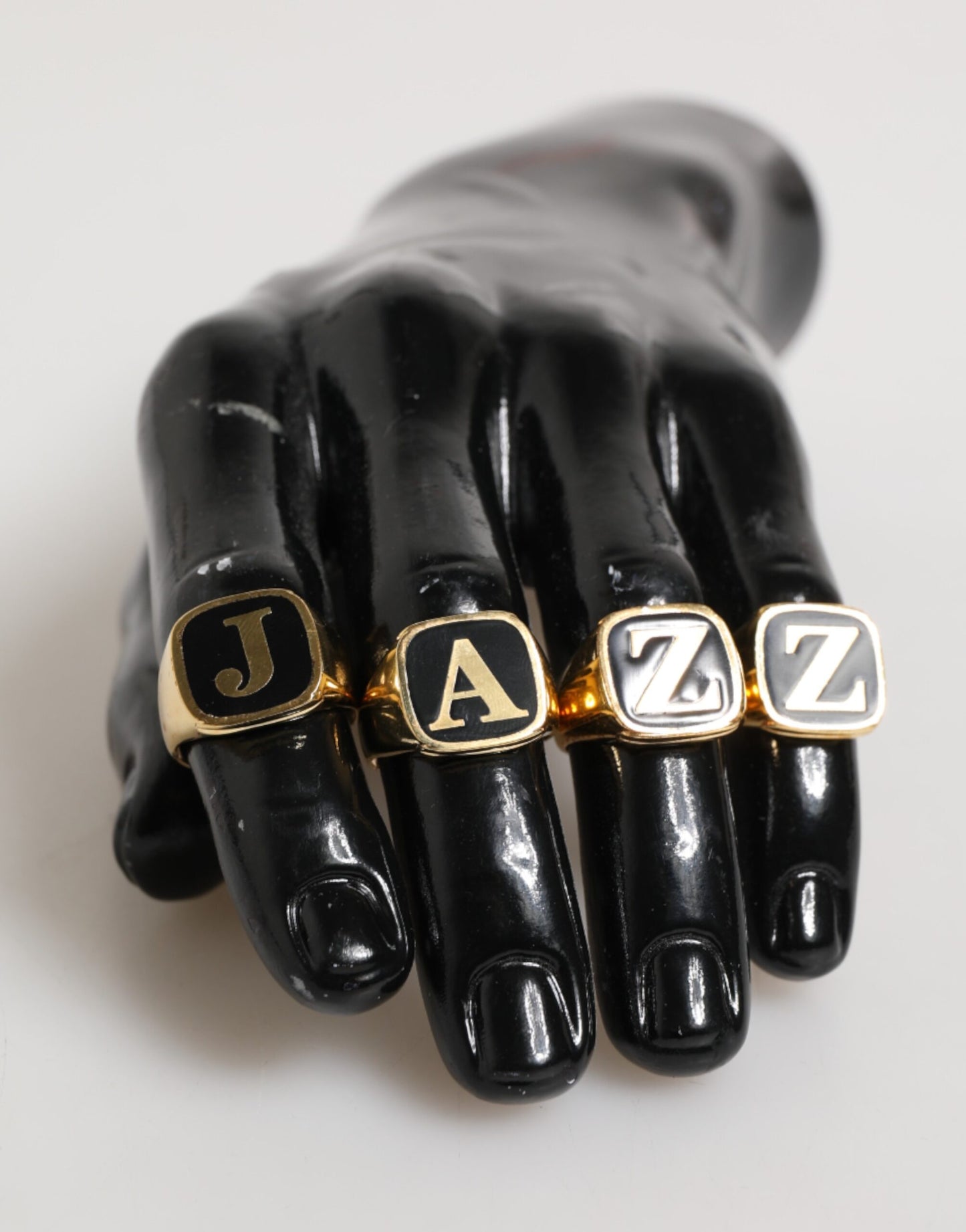 Dolce & Gabbana Gold Tone Brass JAZZ Letter Set 4 Pieces Adjustable Ring Curated Luxury Accessories by Orvyn