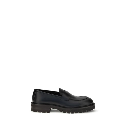Ferragamo Black Calf Leather Bos Taurus Slip-On Loafers Curated Luxury Accessories by Orvyn