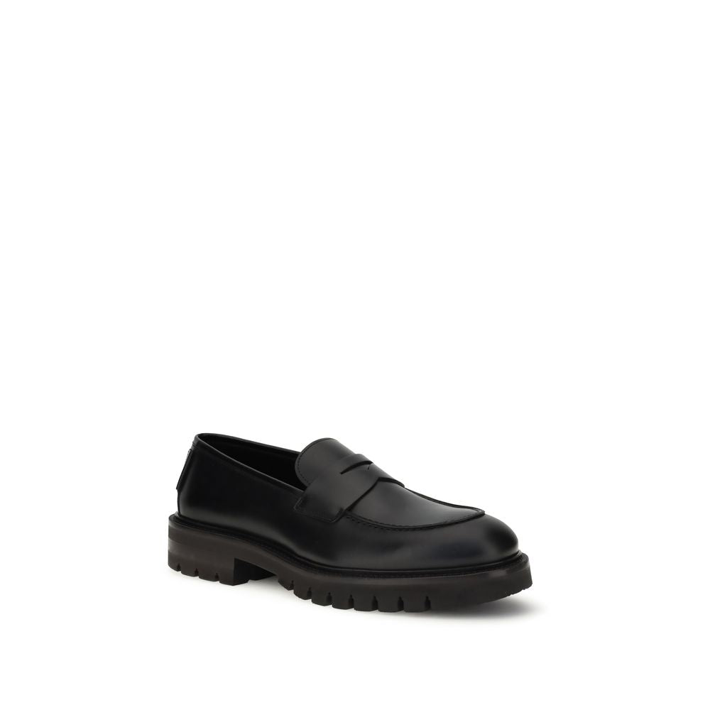 Ferragamo Black Calf Leather Bos Taurus Slip-On Loafers Curated Luxury Accessories by Orvyn