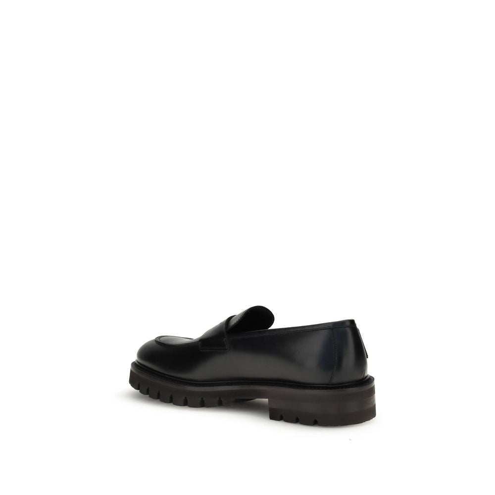 Ferragamo Black Calf Leather Bos Taurus Slip-On Loafers Curated Luxury Accessories by Orvyn