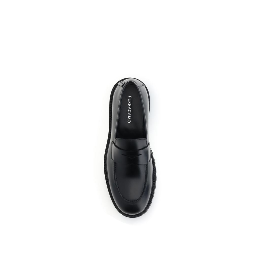 Ferragamo Black Calf Leather Bos Taurus Slip-On Loafers Curated Luxury Accessories by Orvyn