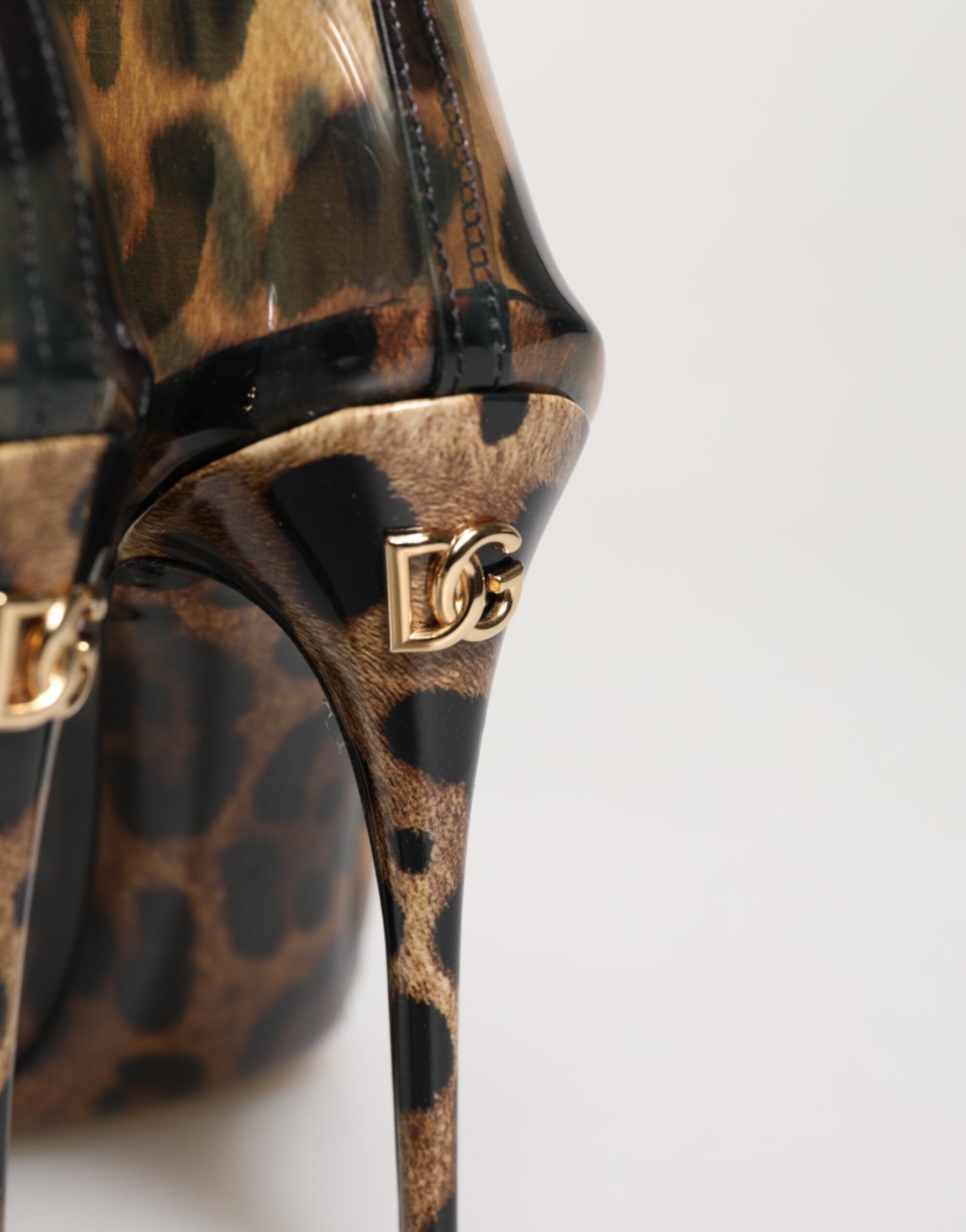 Dolce & Gabbana Leopard Print PVC Pointed Toe Boots Shoes Curated Luxury Accessories by Orvyn