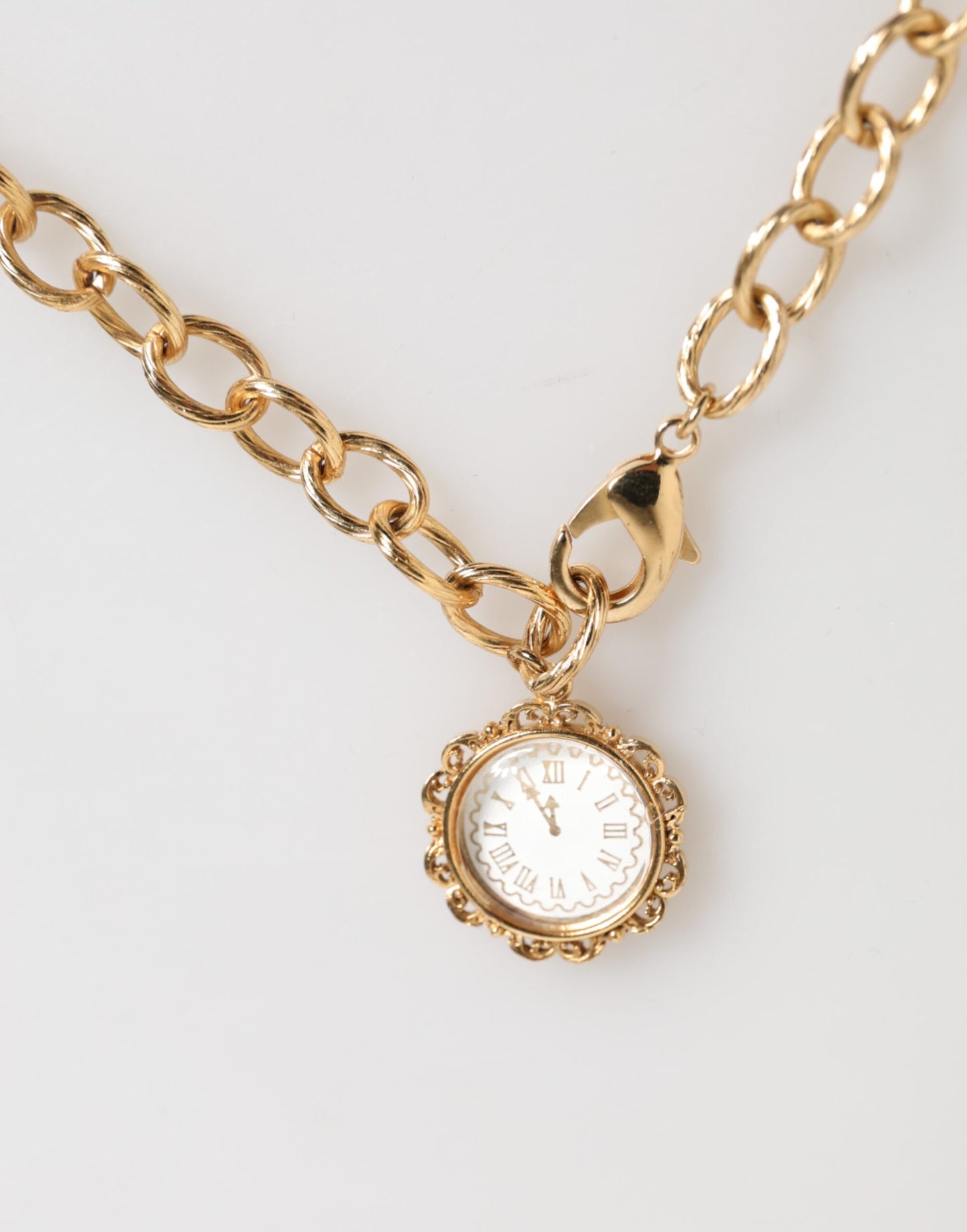 Dolce & Gabbana Gold Crystal Clock Pendant Statement Jewelry Necklace Curated Luxury Accessories by Orvyn