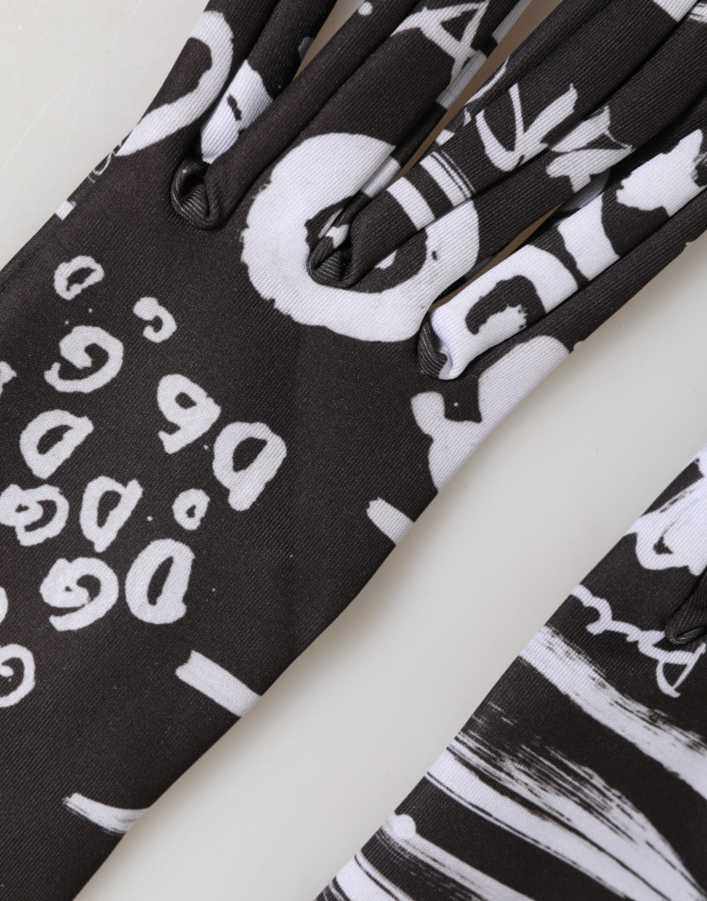 Dolce & Gabbana Black White DG Logo Elbow Length Mitten Gloves Curated Luxury Accessories by Orvyn