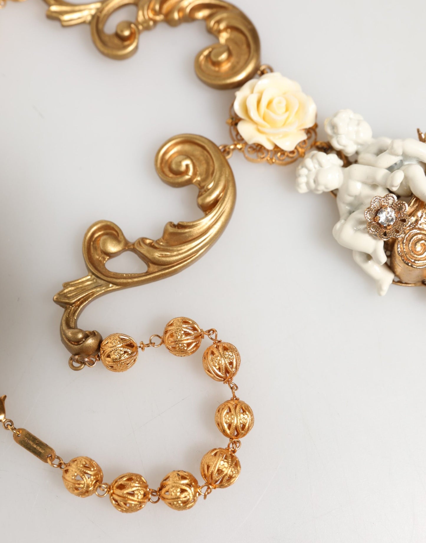 Dolce & Gabbana Gold Ceramic Crystal Cherub Baroque Pendant Necklace Curated Luxury Accessories by Orvyn