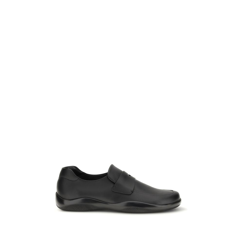 Prada Black Calf Leather Bos Taurus Slip-On Loafers Curated Luxury Accessories by Orvyn