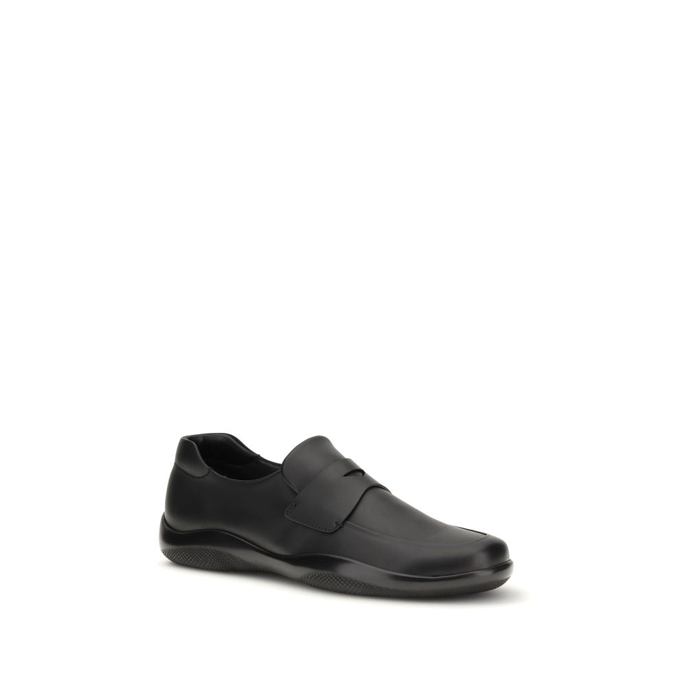 Prada Black Calf Leather Bos Taurus Slip-On Loafers Curated Luxury Accessories by Orvyn