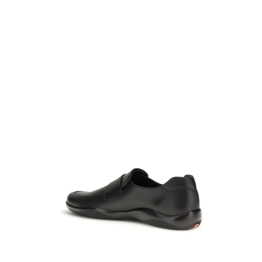 Prada Black Calf Leather Bos Taurus Slip-On Loafers Curated Luxury Accessories by Orvyn