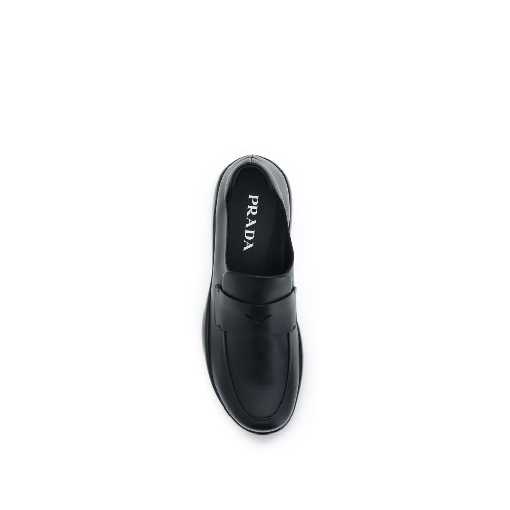 Prada Black Calf Leather Bos Taurus Slip-On Loafers Curated Luxury Accessories by Orvyn